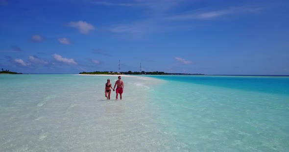 Fun people on romantic honeymoon have fun on beach on white sand background 4K alt