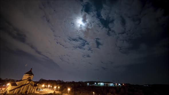 night sky with full moon in the clouds, time lapse