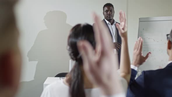 Businessman Talking before Audience alt