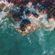 Aerial Top View Of Sea Wave Hitting Cliffs Of A Rocky Coast - VideoHive Item for Sale