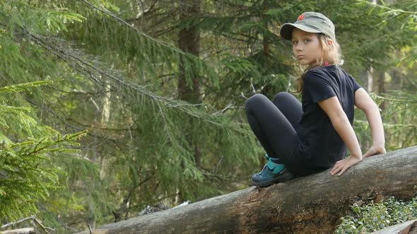 Child Walking At Forest, Kid Outdoor Nature, Girl Playing In Camping Adventure And Sitting On Tree