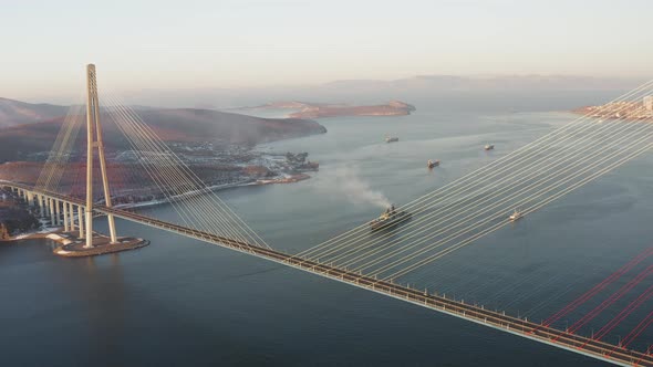 Russian Battleship Ship Passes the Strait Against the Background of the Bridge alt