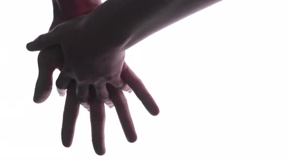 Person does hand gesture with bright white backdrop 5 alt