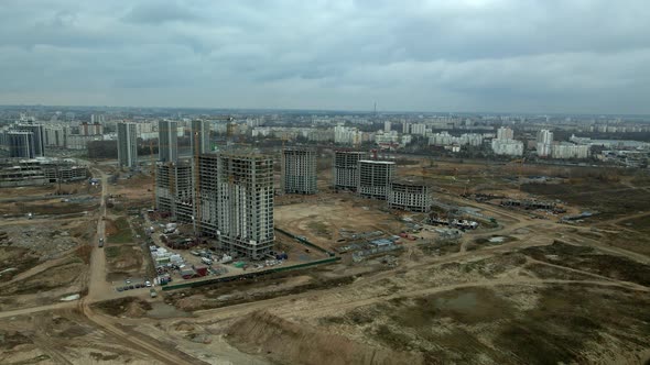 Construction of a modern city block Multi-storey buildings made of glass and concrete. alt