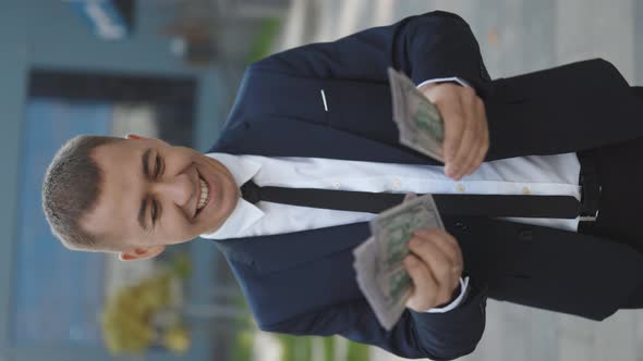Handsome Rich Man Wearing Stylish Suit Counting Money Standing Near Office Building Vertical Video alt