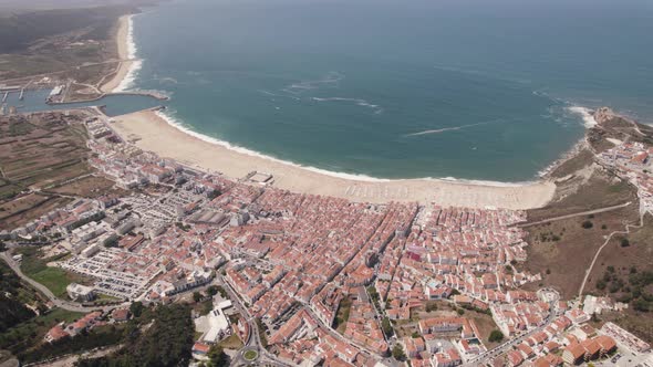 Aerial high view Nazaré Cityscape and beach waterfront, Coastline Holiday Village alt