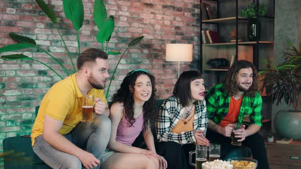 Excited Group of Friends Watching on Tv Football alt