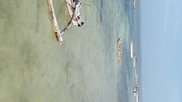 Tanzania Vertical Video  Boat Boats in the Ocean Near the Coast of Zanzibar Aerial View alt