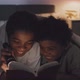 Girl and Boy Reading Book with Flashlight - VideoHive Item for Sale