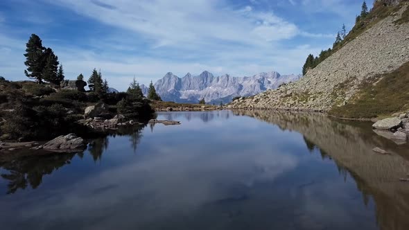 Aerial of Lake Spiegelsee with Reflections of Dachstein, Austria alt