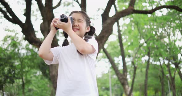 Little girl using camera