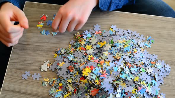 Teenager Collects Puzzles on Coffee Table