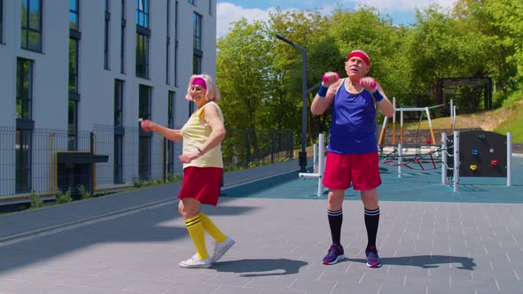 Senior Grandmother Grandfather Working Out on Playground Doing Dancing Sport Stretching Exercising alt