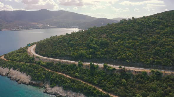 Aerial View of Road on the Mountains Beside Mediterranean Sea Bodrum Turkey alt