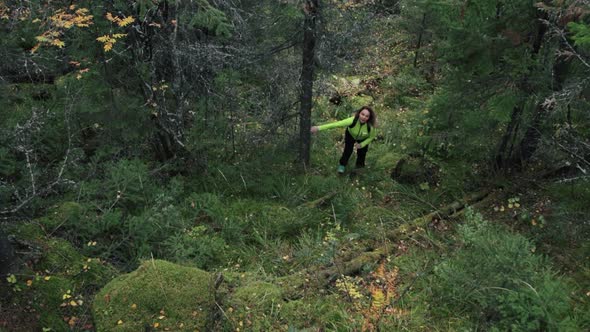 Woman tourist climbing up a hill