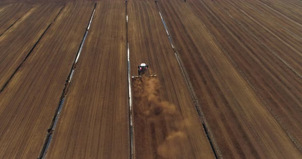 Peat Harvesting Tractor Working in Bog Field Aerial Drone Shot alt