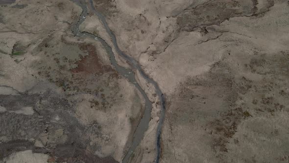 Thermal waters of Reykjadalur hot springs, Iceland. Aerial top-down forward alt