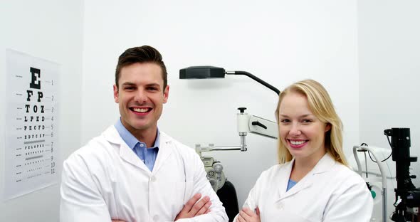 Optometrists standing in ophthalmology clinic alt
