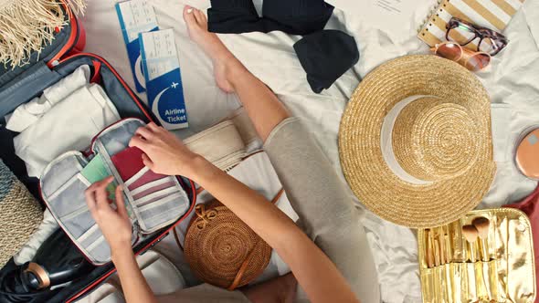 Top View of Woman Packing for Trip alt