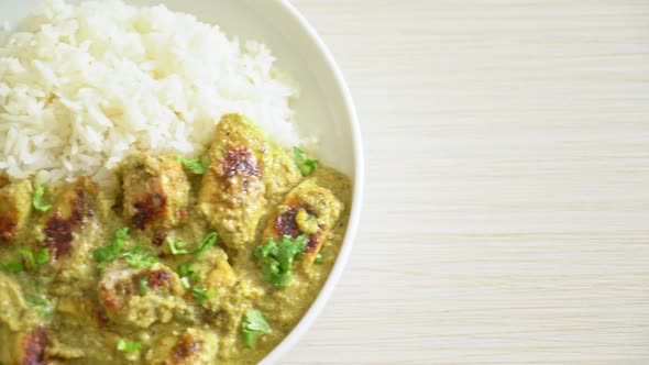 Afghani chicken in green curry or Hariyali tikka chicken hara masala with rice - Asian food style alt