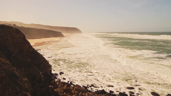 Aerial Drone View of Praia Grande Sandy Beach with Cliffs, showing Coastal Scenery and Coastline at alt