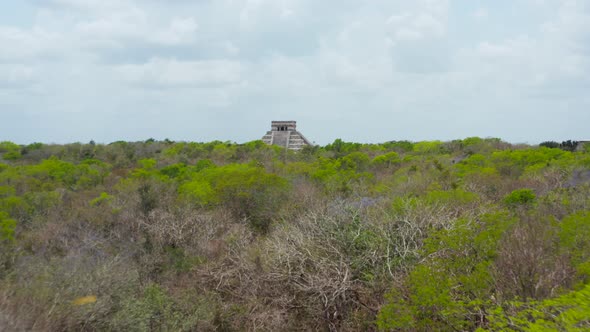 Low Forwards Flight Over Tree Tops to Temple of Kukulcan  El Castillo alt
