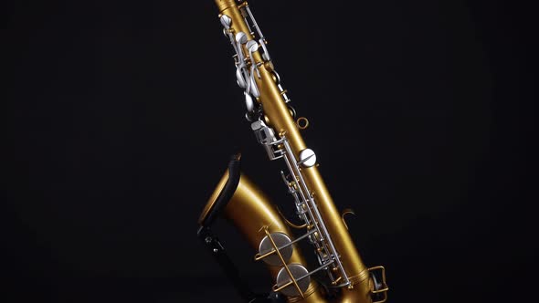 Golden Alto Saxophone On A Black Background.