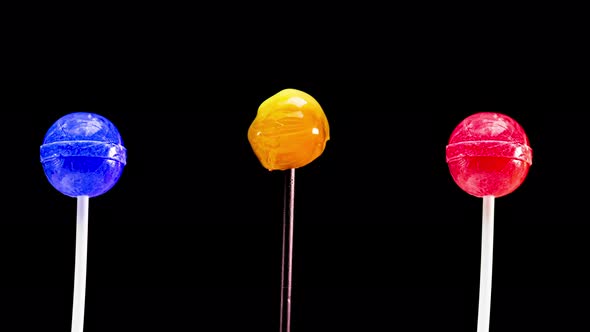 Stop Motion Lollipops Animation On Black Background alt