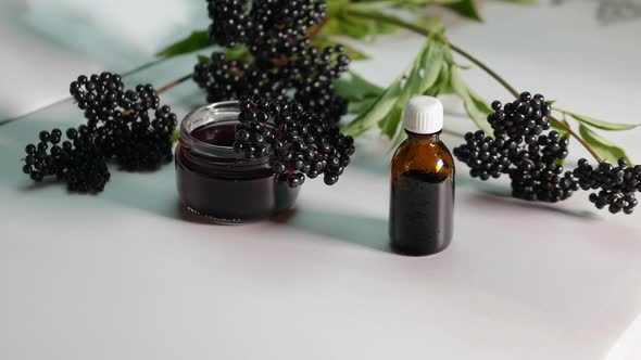 Black Elderberry Herbal Medicine, Ripe Elderberry On A White Background.