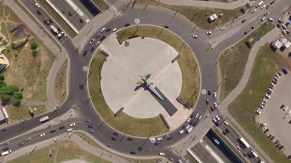 Cars Are Moving on Round Intersection in City in Summer Day, Aerial Shot