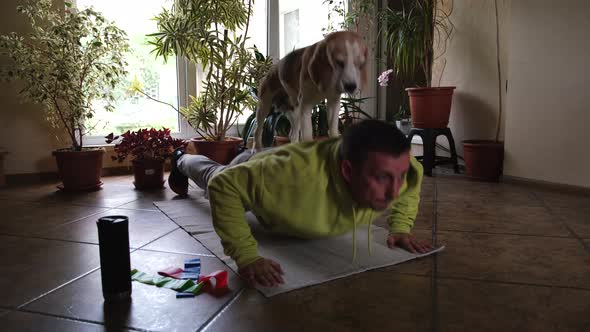 Young Man Doing Pushups Exercises at Home Keeping Himself During Lockdown