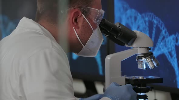 Binocular Microscope and Working Scientist alt