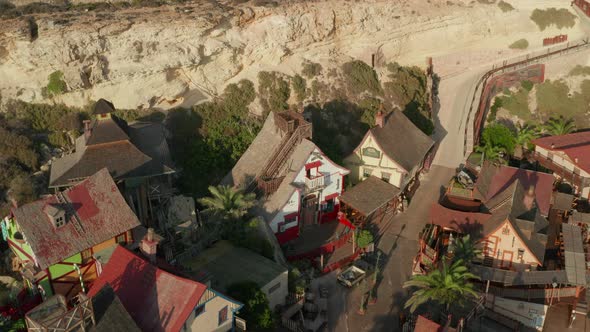 Small, Nice Looking Wooden Houses in Little Fishing Village on Island in Sunset Light, Aerial Drone alt
