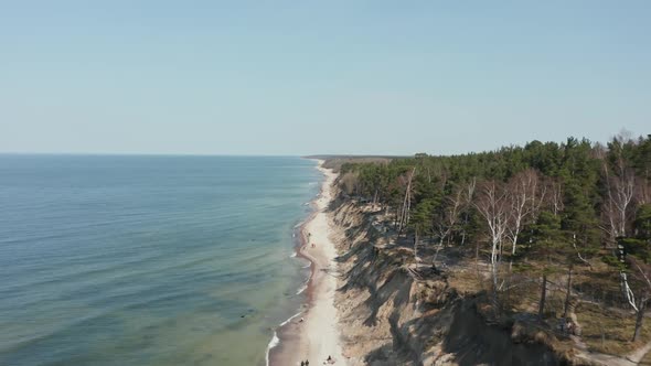 AERIAL: Flying Above The Dutchman's Cap Beach in Klaipeda on a Sunny Day
