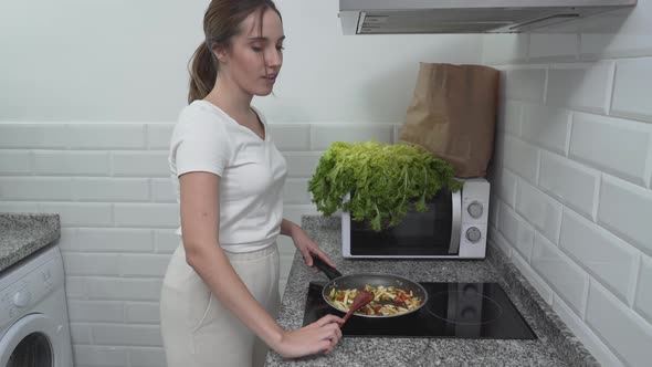 Lovely Housewife Cooked Healthy Vegetable Dish And Placed It In Wooden Bowl alt
