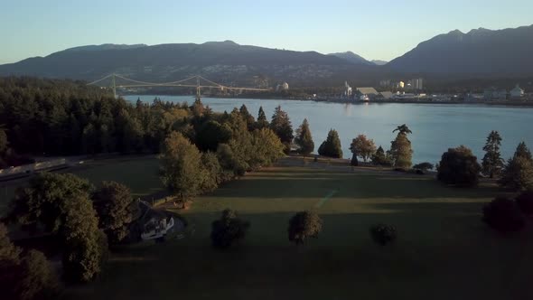 Lions Gate Bridge Over Burrard Inlet From Stanley Park In Vancouver, Canada. - Aerial Drone Shot alt