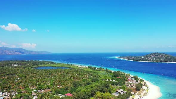 Wide angle aerial tourism shot of a sunshine white sandy paradise beach and aqua turquoise water bac alt