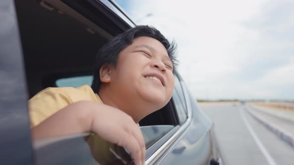 Asian cute boy I was sitting by the window and enjoying the view along the way.