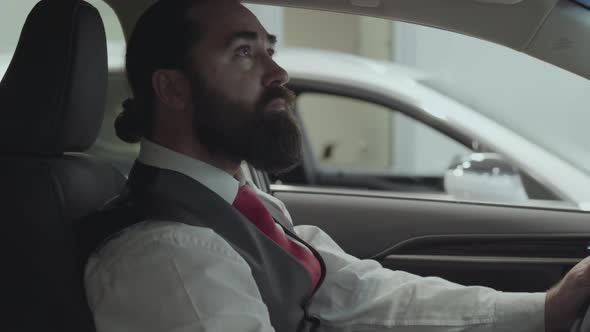 Portrait Attractive Confident Bearded Businessman Sitting in the Vehicle and Inspects Newly alt