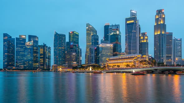 Stunning Twilight View of Singapore City Cityscape Skyscrapers Day To Night Timelapse alt