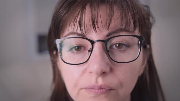 Brunette Woman with Glasses with Emotion Frustration Anger As Usual