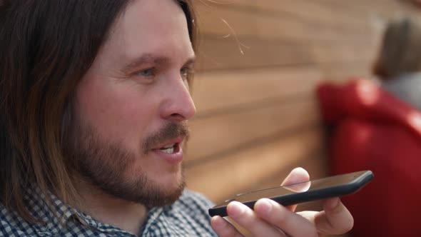 Man Using the Voice Recognition on the Phone, Audio Message Ai Speech Helper, Student Male Outdoor alt