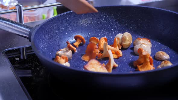 the Chef Fries Wild Mushrooms in a Pan alt