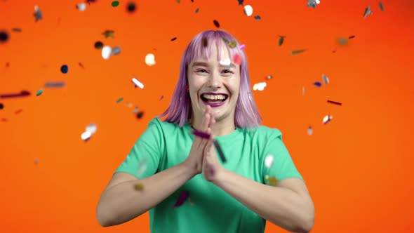 Excited Extraordinary Woman Applauding Having Fun Screaming WOW Rejoices Over Confetti Rain in alt