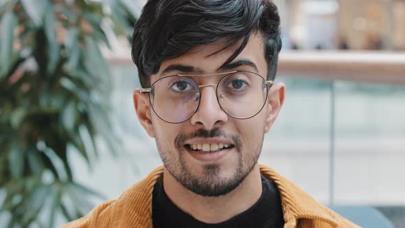 Male Portrait Closeup Young Happy Indian Man with Glasses Looking at Camera Smiling Dental Smile alt