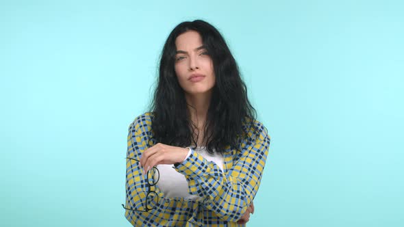 Attractive Skeptical Woman Takesoff Glasses Nod While Listening Shake Head Doubtful and Unamused