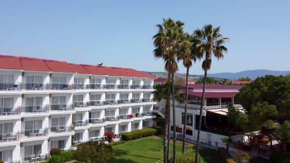Accommodation Hotel Open For Tourists In Kusadasi, Turkey. aerial pullback alt
