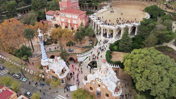 Aerial drone view of Barcelona, Spain. Park Guell with tourists, a lot of greenery alt