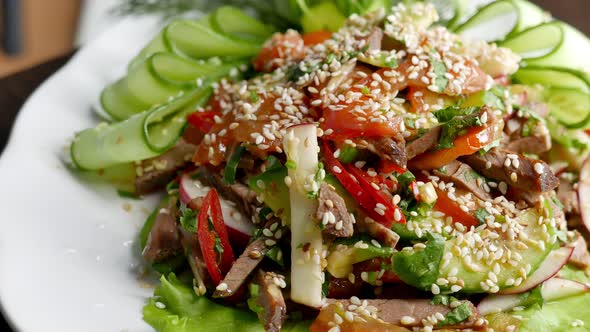 Warm Salad with Meat Vegetables and Sesame