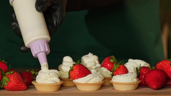 Cooking sweet tartlet with berry. Tasty dessert. Cake with strawberry alt